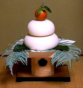 Kagamimochi -- ed rice cakes with a small orange on top, symbolizing prosperity