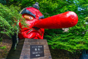 A huge Kurama Tengu face in red: Kurama temple in Sakyo-ku, Kyoto, Japan. Kurama temple is famous as a place Yoshitsune Minamoto trained in his childhood.