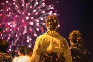 Japanese girls wearing yukata are seen viewing Fireworks in Karatsu, Saga Prefecture.