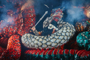 A Japanese samurai fighting against Yamata no Orochi (legendary 8-headed and 8-tailed Japanese dragon) in Kagura performance