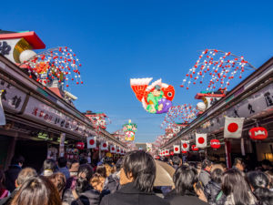 TOKYO, JAPAN - JAN 3: A crowd of Hatsumode at Senso-ji Temple in Tokyo, Japan on January 3, 2016. Hatsumode is the first Shinto shrine or Buddhist temple visit of the Japanese New Year.