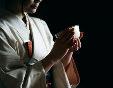 Japanese tea ceremony, a woman in kimono holding a tea cup