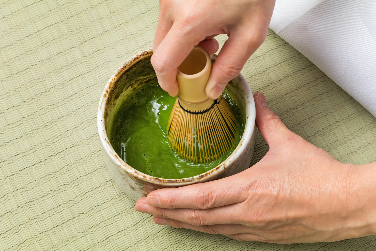 The Japanese tea ceremony, serving tea infused with matcha