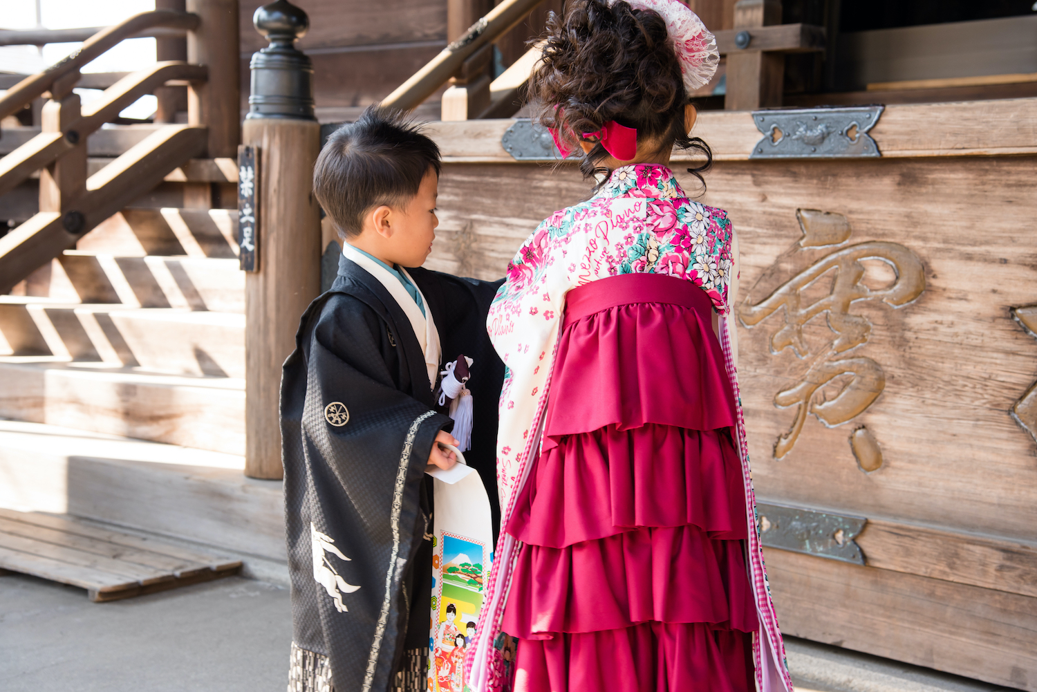 A girl in modern kimono and a boy in hakama for the Shichigosan festival