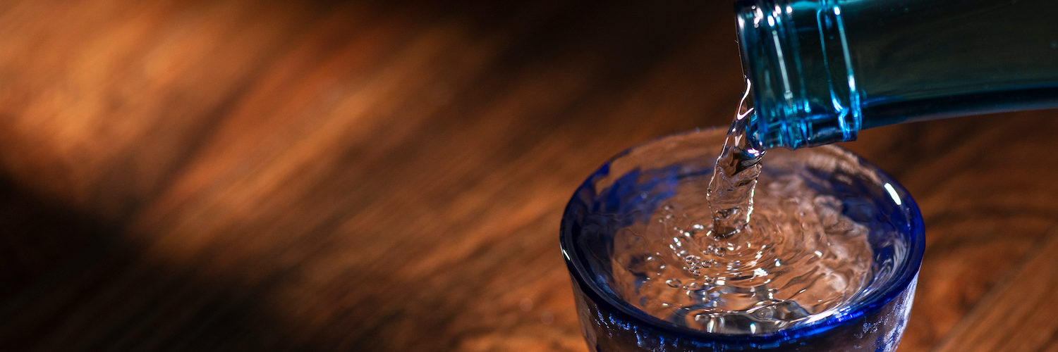 Pour sake into a transparent sake set