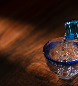 Pour sake into a transparent sake set