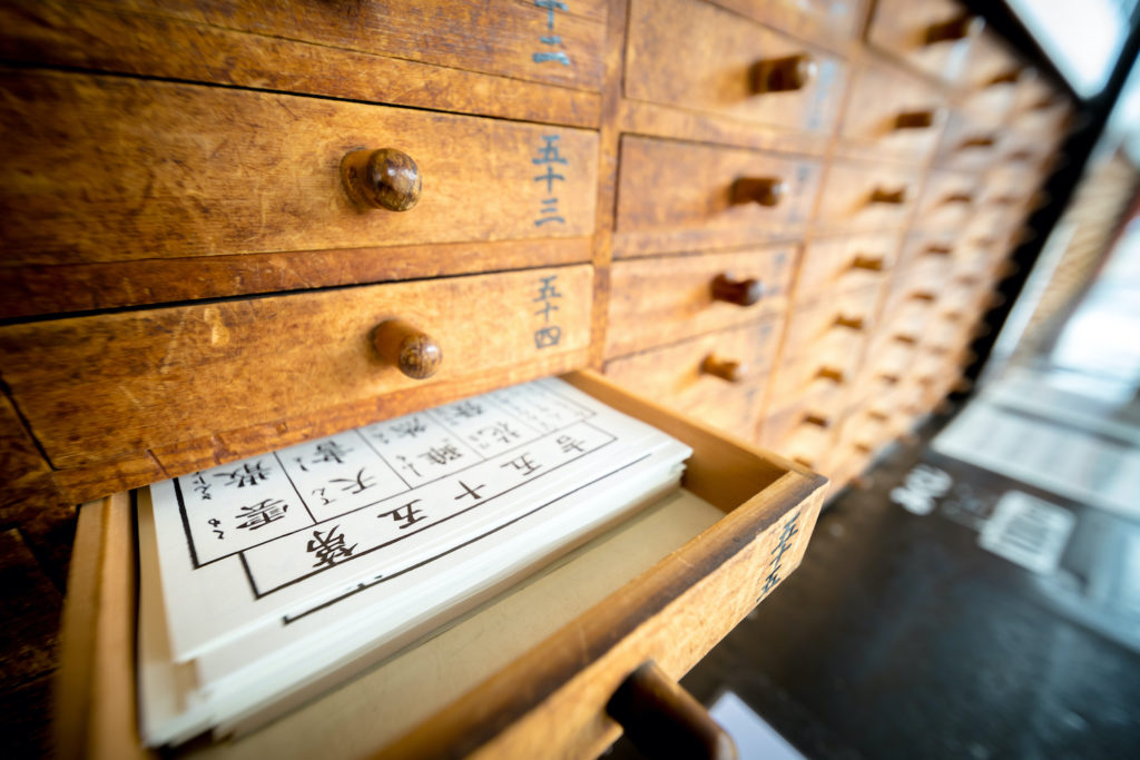 Tokyo, Japan - 15 March 2017: Omikuji (Paper Fortune) in a drawer at Senso ji. “Omikuji” is a strip of paper that predicts your fortune when you make a prayer to the gods and buddhas.