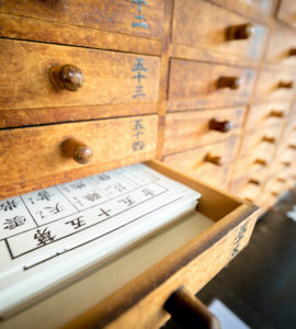 Tokyo, Japan - 15 March 2017: Omikuji (Paper Fortune) in a drawer at Senso ji. “Omikuji” is a strip of paper that predicts your fortune when you make a prayer to the gods and buddhas.