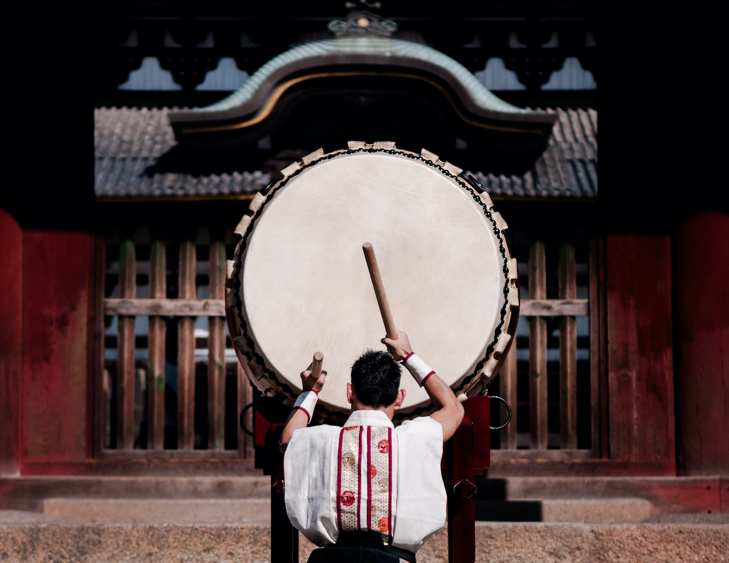 A man performs traditional Japanese Taiko drum.