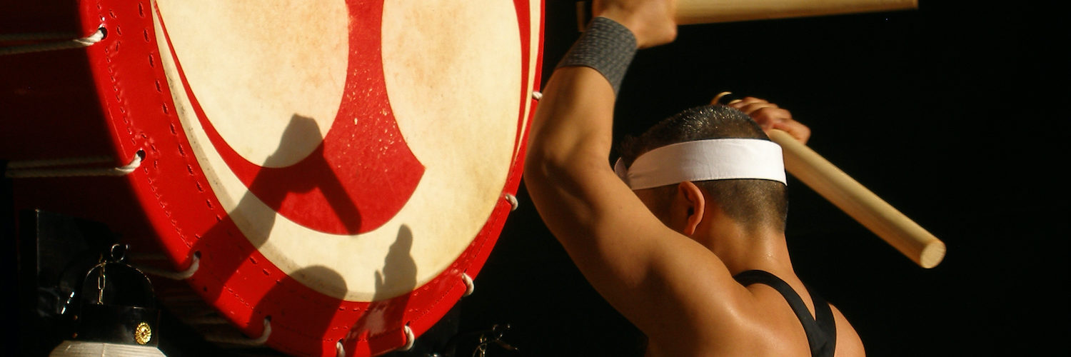 Traditional Japanese drummer with a large Japanese drum