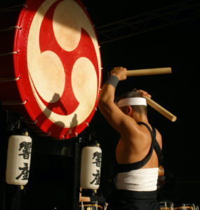 Traditional Japanese drummer with a large Japanese drum