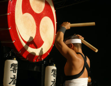 Traditional Japanese drummer with a large Japanese drum