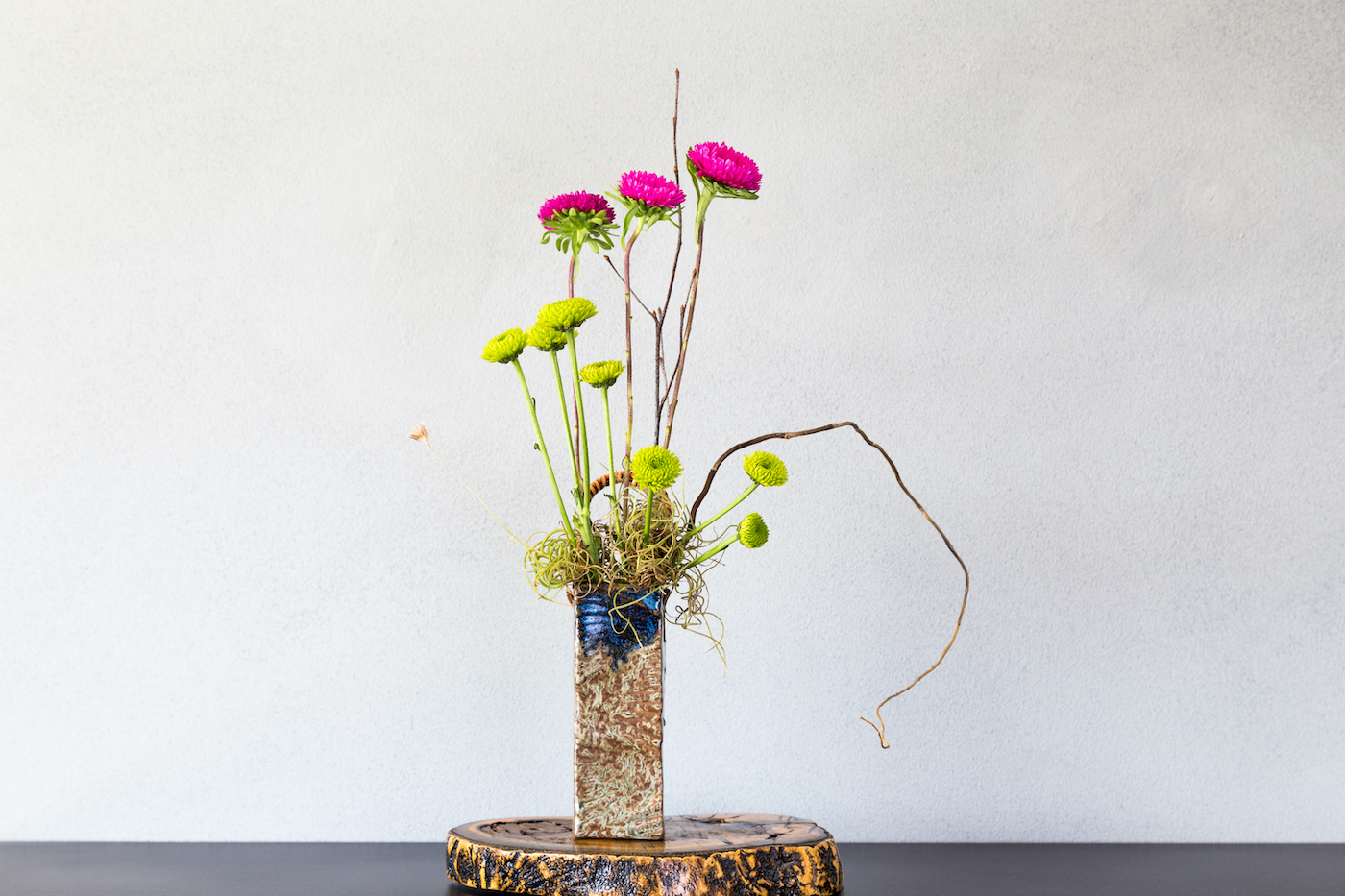 Ikebana, a Japanese flower arrangement, simply puts flowers in a tall vase, nageire style.
