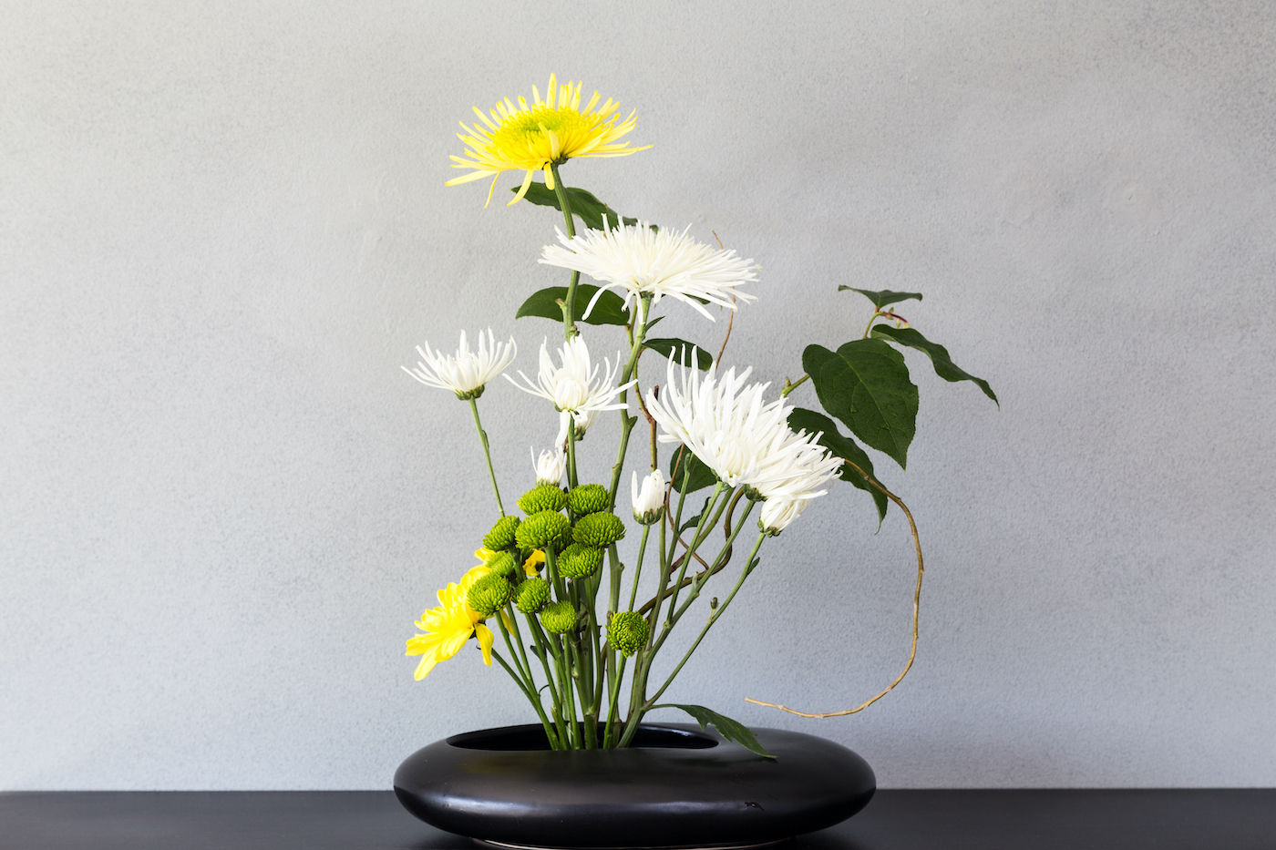 Ikebana, a Japanese flower arrangement, simply puts flowers in a container.
