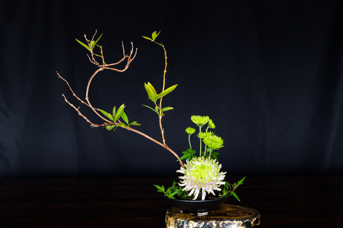 Ikebana, a Japanese flower arrangement, simply puts flowers in a container.