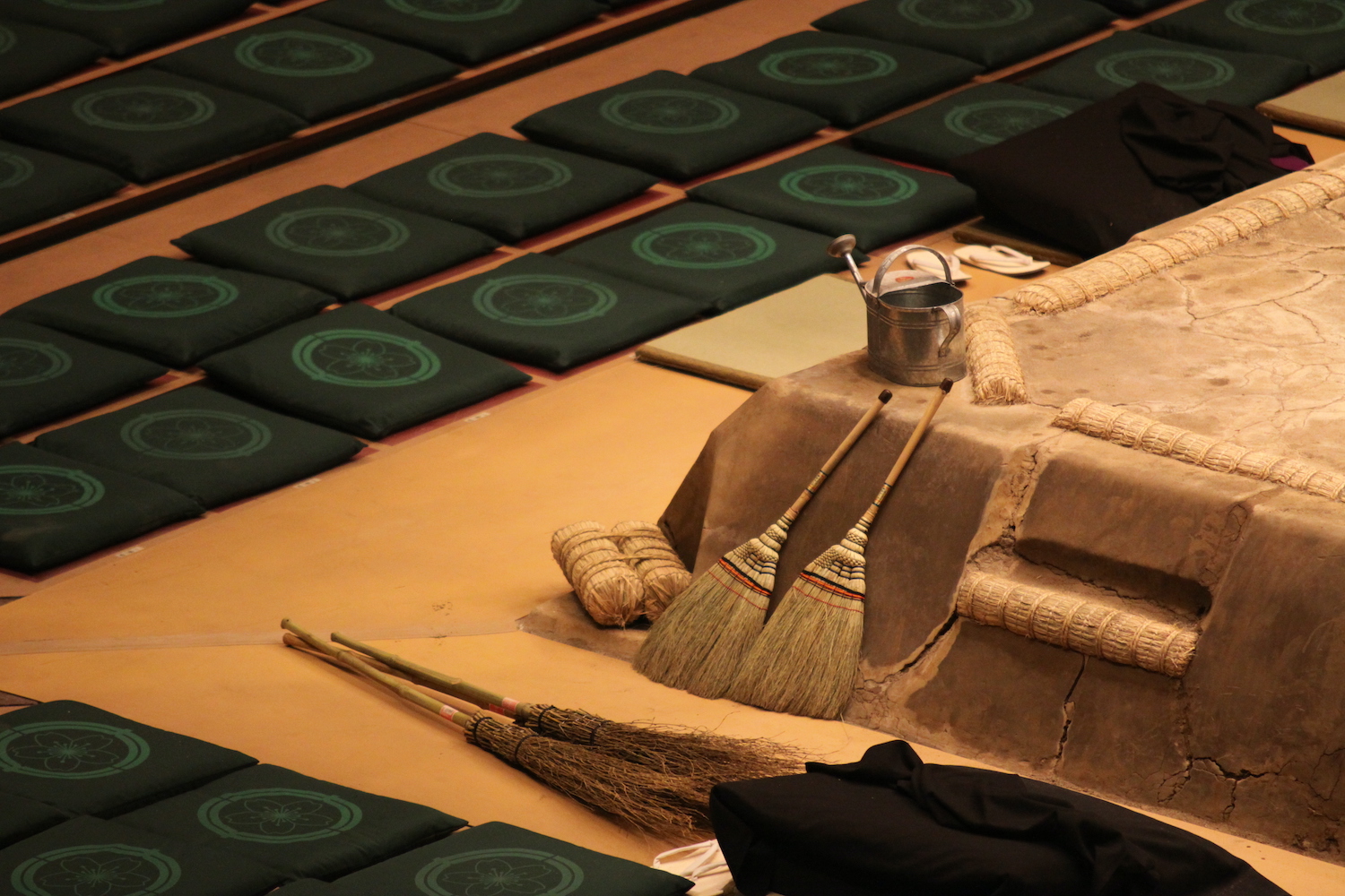 Brooms lean against the sumo ring in Tokyo, Japan