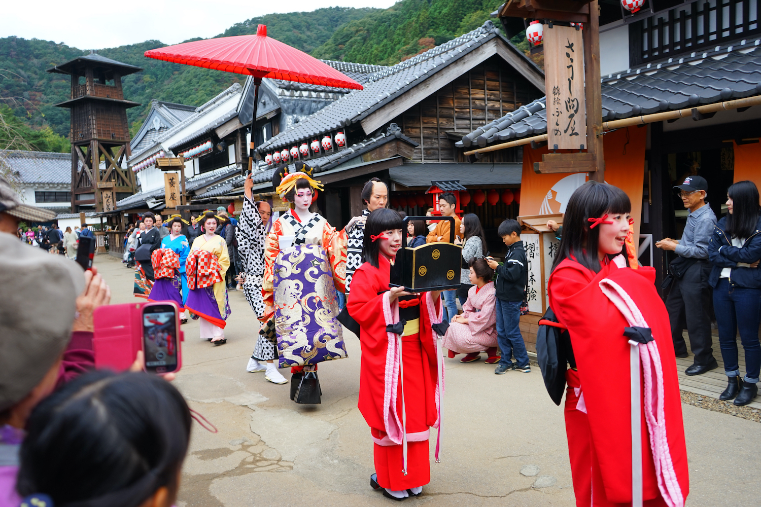 Nikko, Japan - Oct. 28, 2019: Elegant oiran courtesans parade through the streets of Edo with their full entourage. Oiran means the highest rank of courtesan.