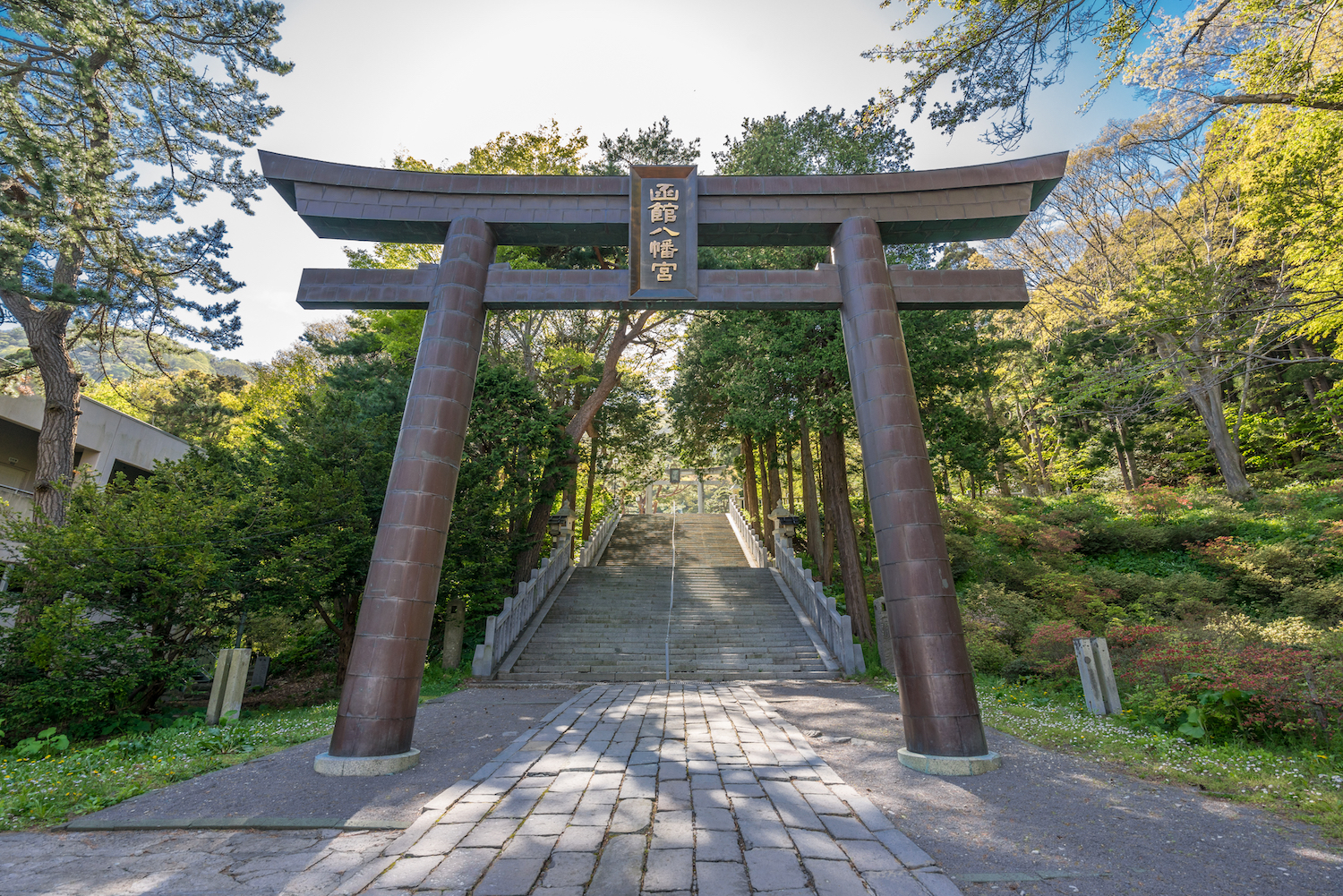 Tori Gate and stairs at Hakodate Hachimangu (Hakodate Hachiman Shrine). A Shinto shrine dedicated to the divinity of archery and war. Located in Yachigashiracho street, Hakodate city, Hokkaido, Japan