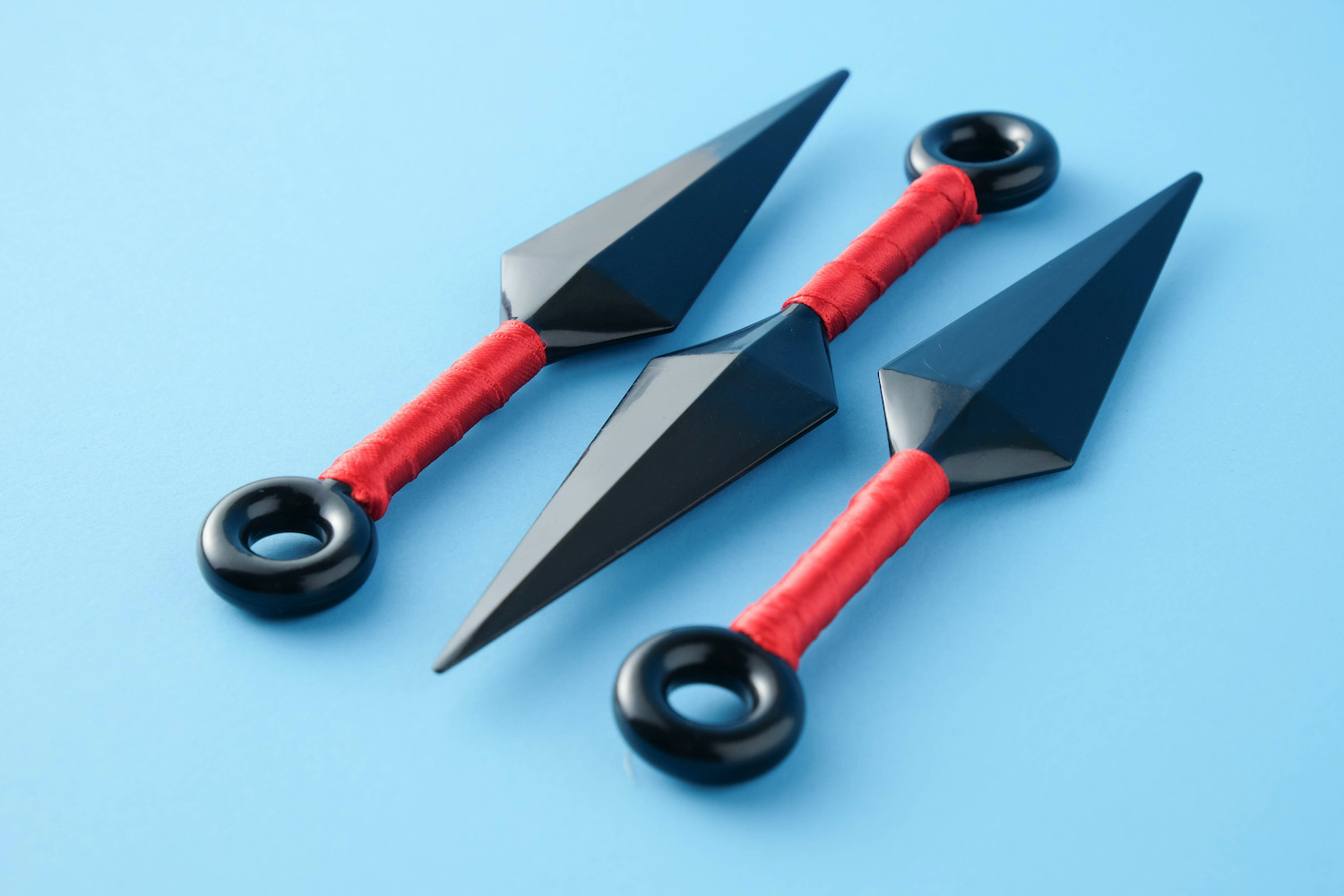 Kunai: Ninja weapons isolated on blue paper background