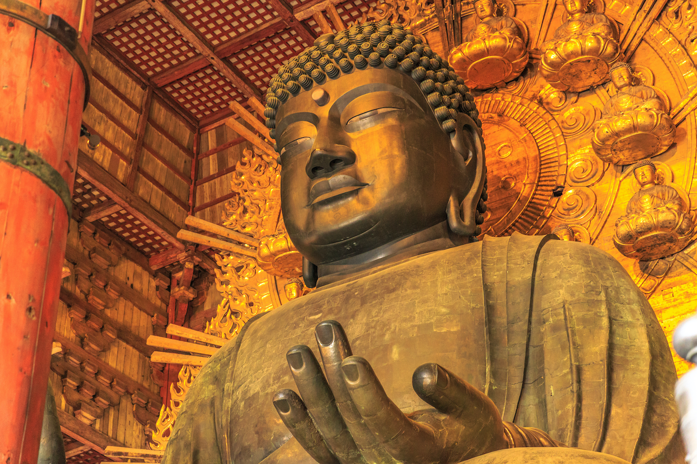 Nara, Japan - April 26, 2017: Details of Great Buddha or Daibutsu, the world's largest bronze statue of Buddha Vairocana. Todai-ji a Buddhist Temple in Nara, Japan. The Great Buddha was built in prayers of solacing people's hearts under the condition of natural disasters.