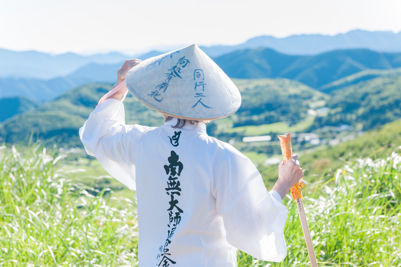 Pilgrims looking over the mountains on her pilgrimage