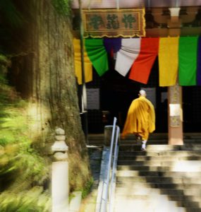 Japanese Buddhism, Buddhist monk at Mt. Koyasan stepping up to the temple