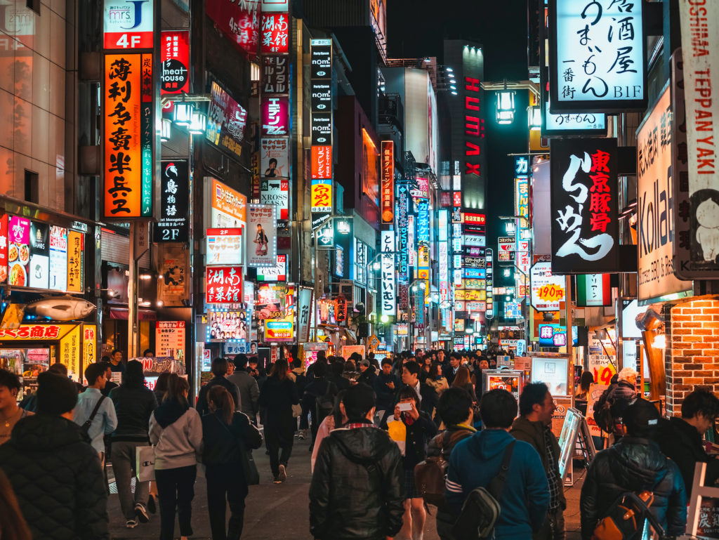 TOKYO, JAPAN - APR 12, 2019 : Kabuki-cho Colourful Neon lights, Shinjuku Famous street Crowd people Nightclub Bar Restaurant Tokyo Japan nightlife