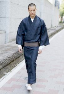A man in Yukata matching with white sneakers and a long t-shirt