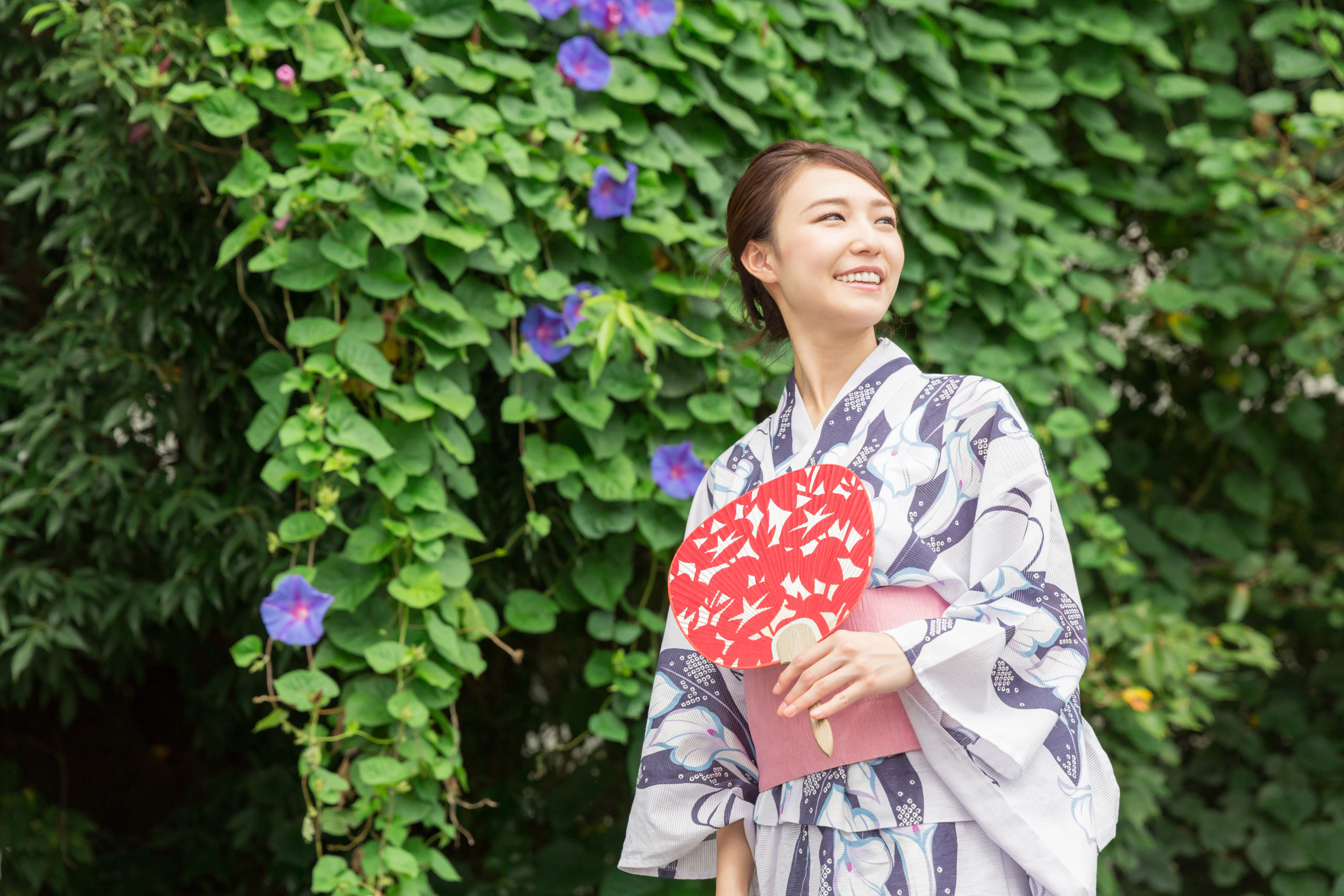 A woman in yukata holding a fan