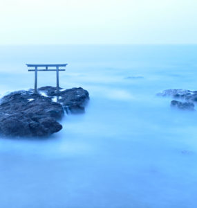 Torii - gateway of shrine in the sea in the early morning by long