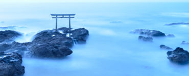 Torii - gateway of shrine in the sea in the early morning by long