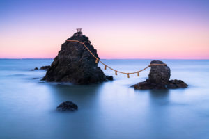 The wedded rocks (Meoto Iwa) in Ise, Japan on sunset. The larger of the two rocks represents the husband and the smaller one represents the wife.